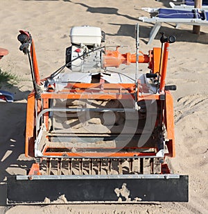 tractor machinery to clean the beach- photo