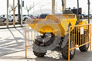 Tractor for the maintenance and repair of the asphalt and pavements of a street in a large city. Heavy machinery and construction