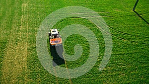 Tractor makes fertilizer on the field. Aerial survey