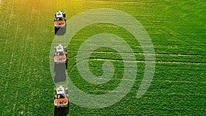 Tractor makes fertilizer on the field. Top view