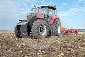 Tractor makes tillage photo