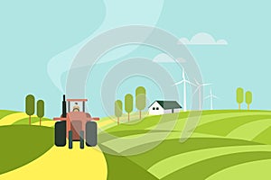 A tractor moving through a farm with farm house and wind mills