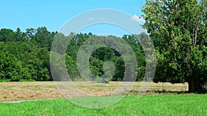 Tractor mowing a field in a park