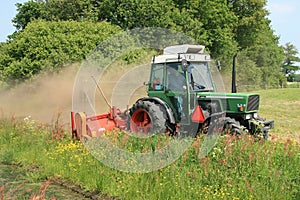 Tractor mowing grass