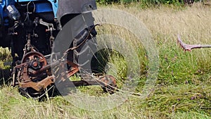 Tractor mows grass