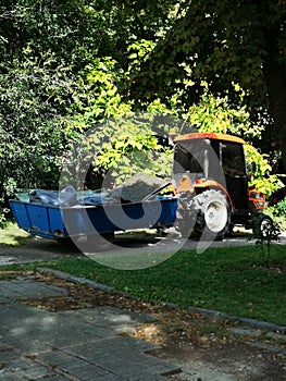Tractor in outdoor with blue trailer