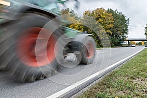 Tractor passing by on a national highway, Germany