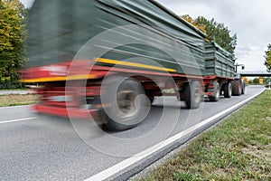 Tractor passing by on a national highway, Germany