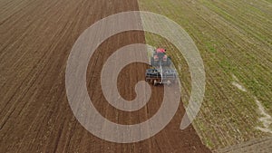 Tractor performing tillage disc cultivator