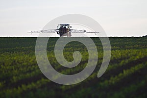 Tractor with pesticide on field