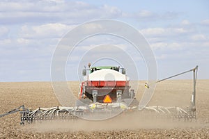 Tractor Planting Seed In Field