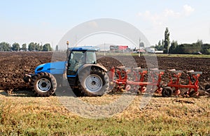 Tractor with plough photo