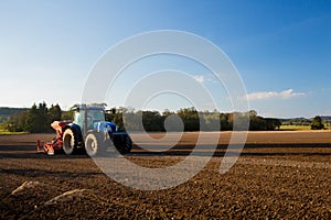 Tractor ploughs field