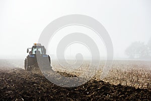 Tractor plowing field