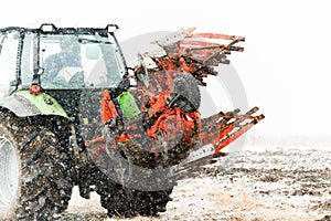 Tractor plowing a field