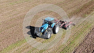 Tractor plowing field