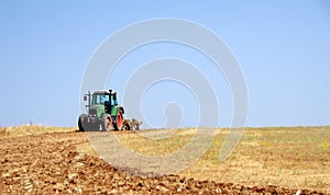 Tractor plowing the field