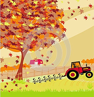 Tractor plowing field in autumn