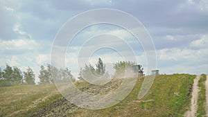 Tractor plowing field with the grass in 4K