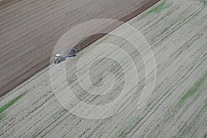 Tractor plowing the field photo