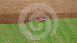 Tractor Plowing A Field Prepares The Agricultural Land For Planting Crop Aerial