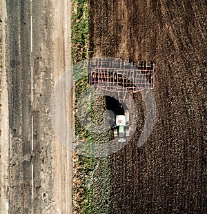 Tractor plowing field, top view