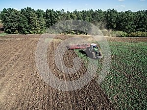 Tractor plowing field, top view