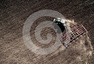 Tractor plowing field, top view