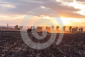 Tractor plowing fields