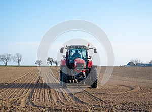 Tractor plowing fields