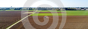 Tractor plowing the fields, aerial view, plowing, sowing, harvest. Agriculture and Farming, campaign