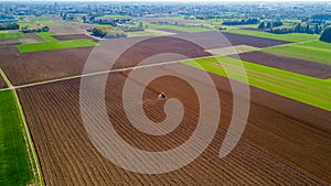 Tractor plowing the fields, aerial view, plowing, sowing, harvest. Agriculture and Farming, campaign