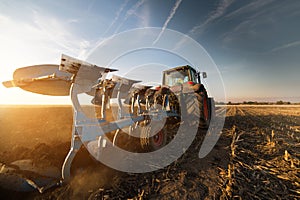 Tractor plowing fields -preparing land for sowings