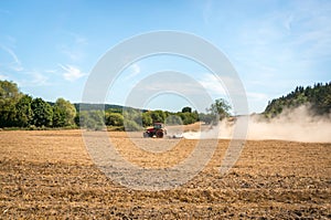 Tractor plows a field - agriculture and agronomy concept