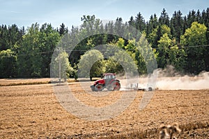 Tractor plows a field - agriculture and agronomy concept