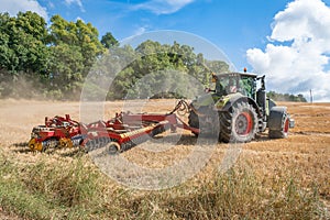 Tractor plows a field - agriculture and agronomy concept