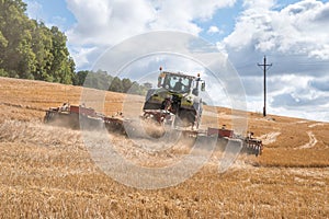 Tractor plows a field - agriculture and agronomy concept