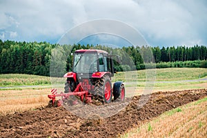 Tractor plows the land