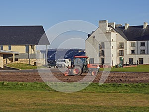 A Tractor preparing the new practise putting Green ahead of the 147th Golf Open Championship being held in Carnoustie.