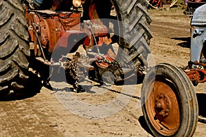 Tractor pulling another tractor which is stalled