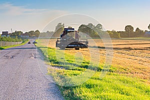 Tractor reaping wheat