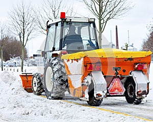 Tractor removes snow in a park