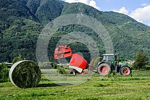 Tractor with round baler