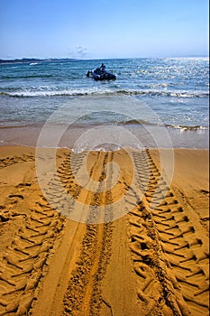 Tractor's wheel mark on beach