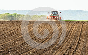 Tractor and seeder for sowing corn