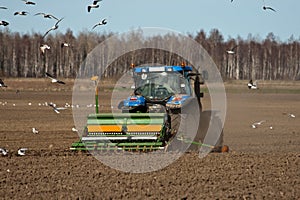 Tractor sowing seed