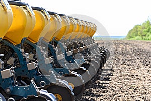 A tractor sows a field with grain