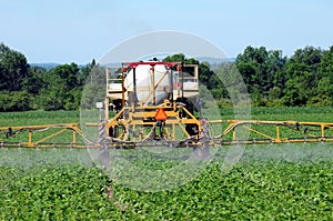 Tractor spaying pesticide