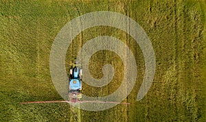 Tractor spray fertilize field