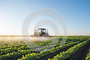 Tractor spraying